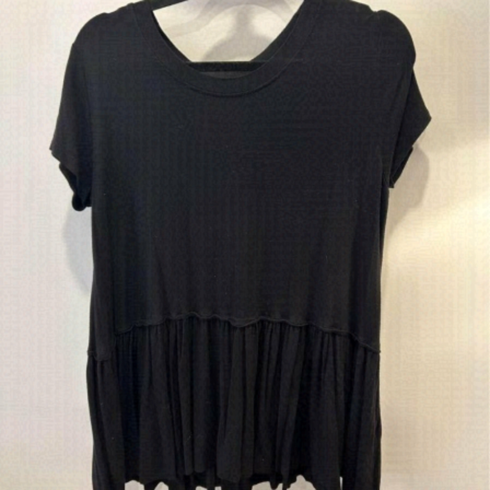Woman’s black peplum t-shirt. Ultra soft. Size small. Crew neck. Oversized fit,